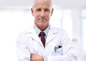 Portrait of a confident doctor with folded arms